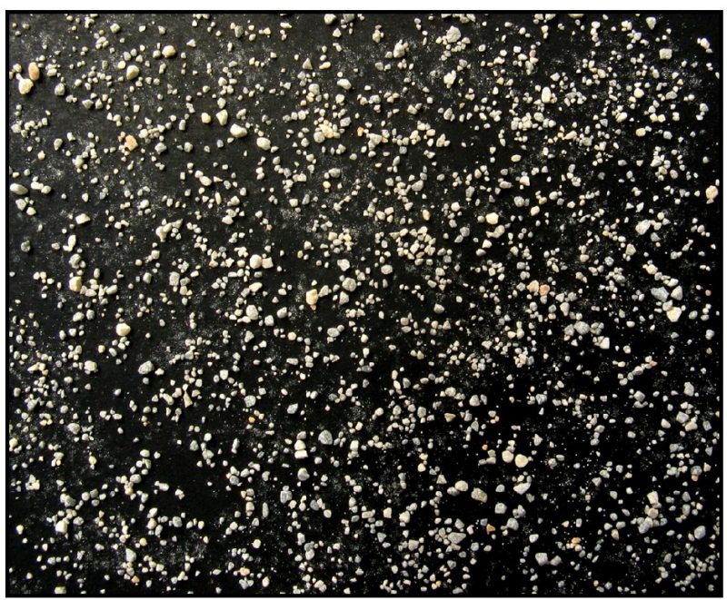Agricultural limestone particles ground to pass a 20-mesh sieve and retained on a 60-mesh sieve.