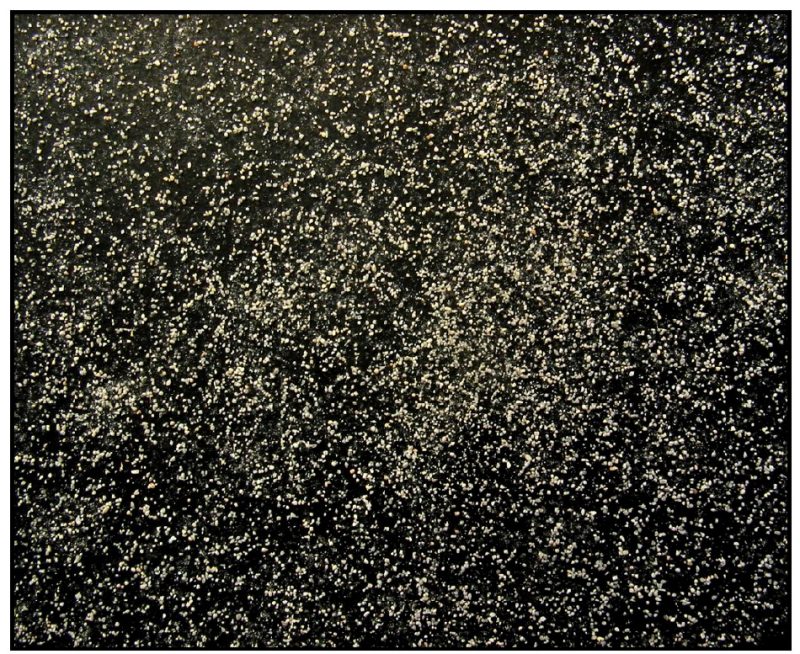 Agricultural limestone particles ground to pass a 60-mesh sieve and retained on a 100-mesh sieve.
