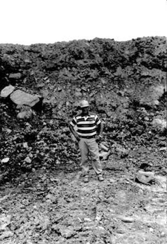 The 15-foot surcharge preloading fill at the Red Onion Prison site during surcharge removal. The excavation supervisor is standing on surcharged fill after partial surcharge removal with remaining surcharge material in the background.