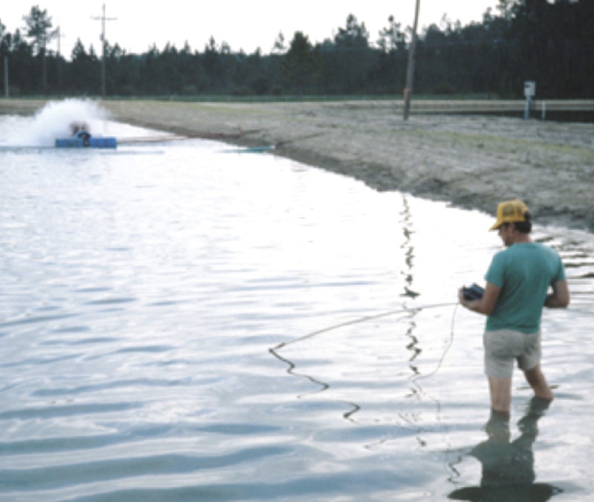 photo of a person fishing in a river