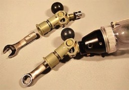 Two examplles of prosthetic hand-tool systems both hand-tool system are shown with combination wrenches.