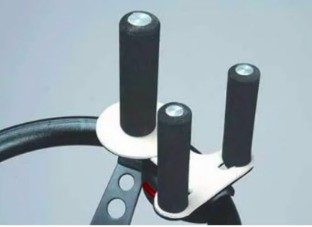 A steering wheel with a three pin spinner attached.