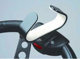 Steering wheel with a palm-grip spinner attached. The palm-grip spinner is in a C-shape with the flattest part of the C against the steering wheel and the opening facing up.