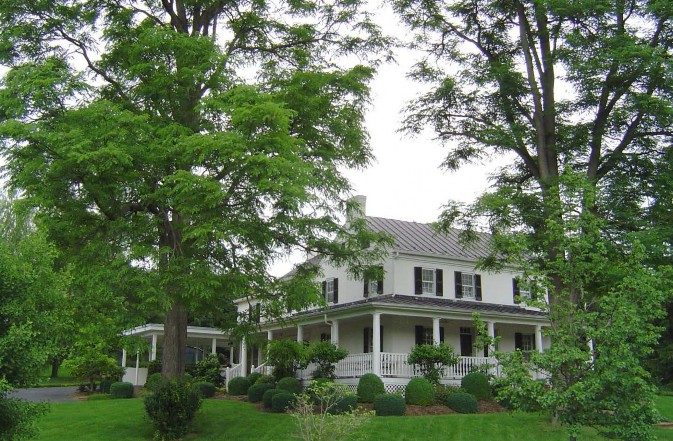 a photo of a house with trees