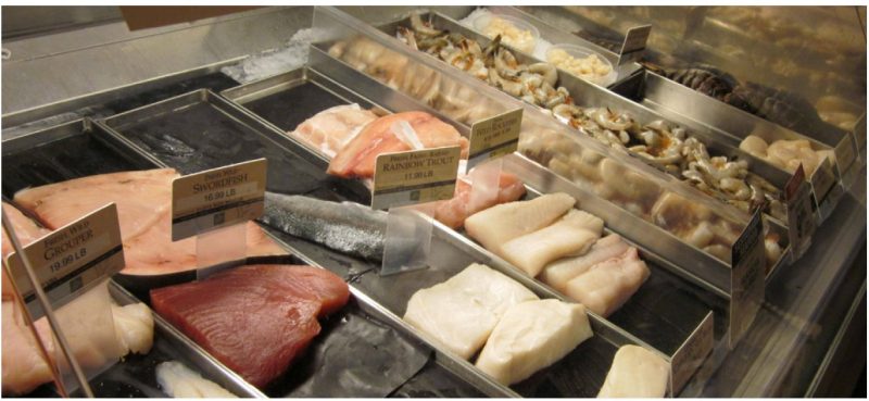 Display of various fresh seafood cuts.