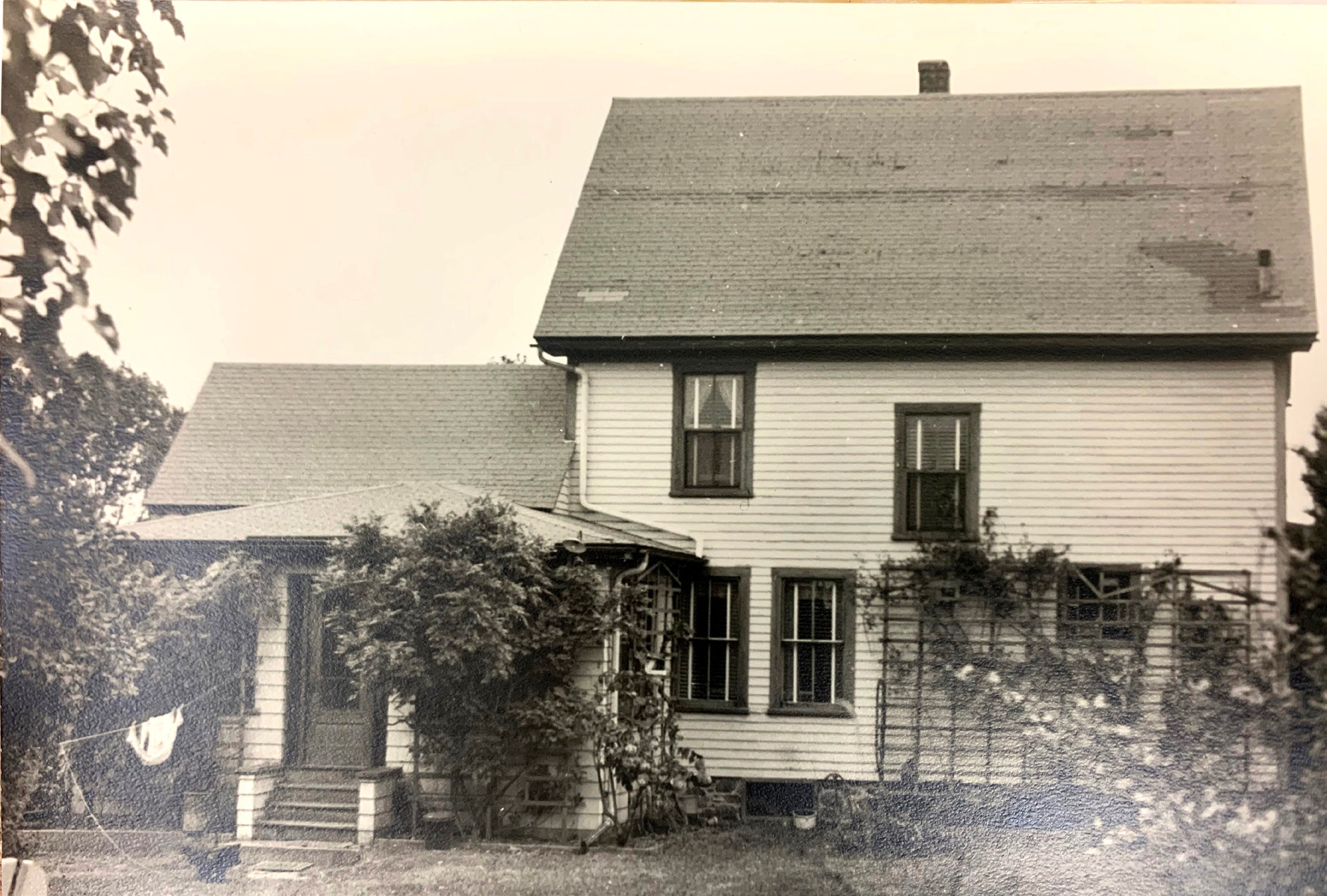 an old black and white photo of a house