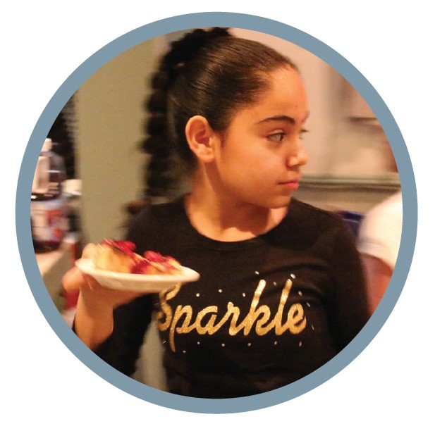 Picture of a girl holding a plate of dessert