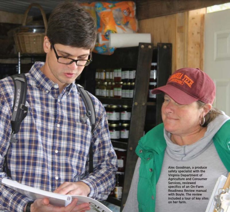 photo of two people reading a manual