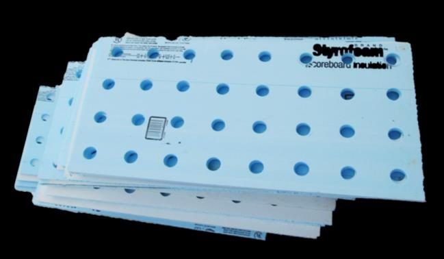 Figure 12. A picture of a stack of Styrofoam insulation boards with evenly spaced drilled holes for holding plants.