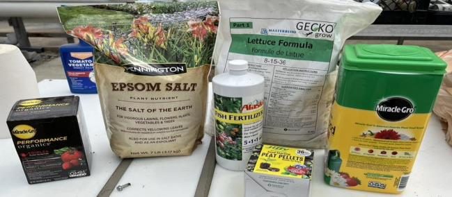 Figure 13. Photo of an array of different kinds of fertilizers such as bagged epsom salts, miracle-gro powder, and liquid and pelleted formulations.