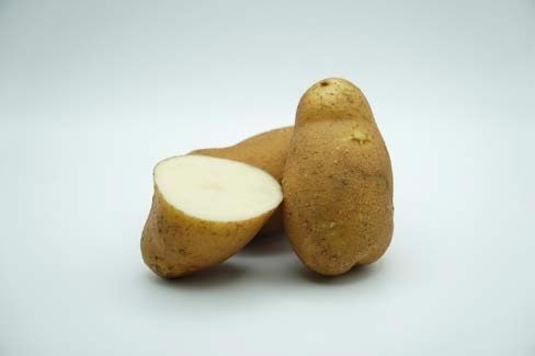 Close up of a cut up potato.