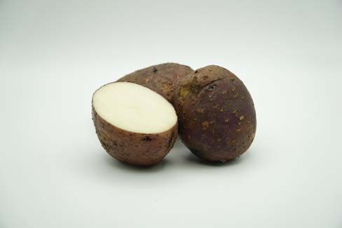 Close up of a cut up potato.